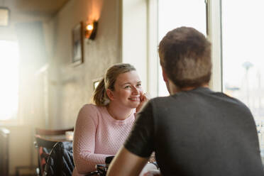 Romantic couple resting in cozy cafe - CAVF91754