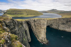 Rocky cliff with lake on hill - CAVF91786