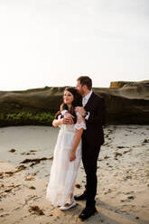 Newlyweds on Beach at Sunset in San Diego - CAVF91817