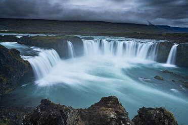 Idyllic shot Godafoss waterfall against cloudy sky, Northern Iceland - CAVF91886