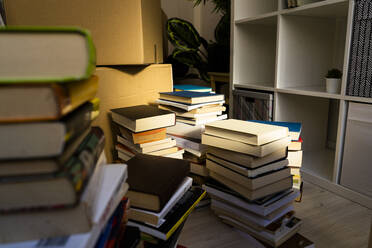 Stack of books in new loft apartment - GIOF10701