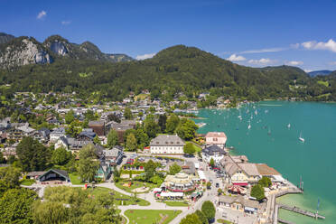 Austria, Salzburg, Sankt Gilgen, Aerial view of village on shore of Lake Wolfgang in summer - TAMF02790