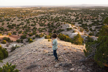 Young boy looking down at Galisteo Basin - MINF15590