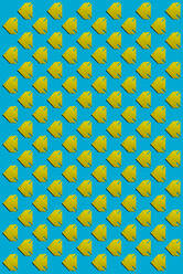 Pattern of yellow origami fish against blue background - KNTF06163