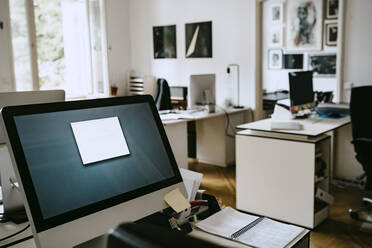 Computer on desk in creative office - MASF21292