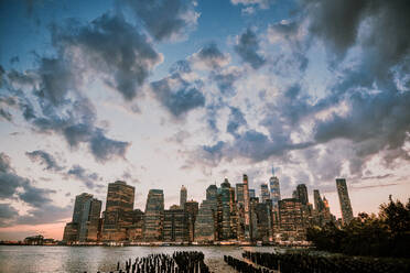 New York City skyline during dusk with storm clouds. - CAVF91946