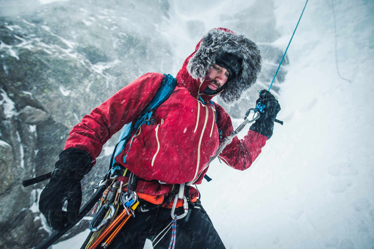 A Mountain Climber Rappelling on a Rope · Free Stock Photo