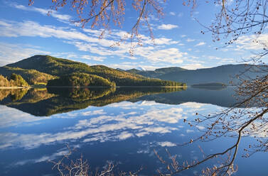 Hills and clouds reflected in calm lake, Lake Walchensee, Bavaria, Germany - MRF02444