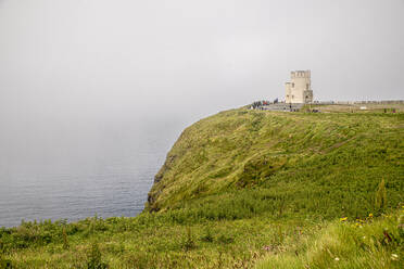 Cliffs of Moher by sea against cloudy sky at Clare, Ireland - BIGF00074