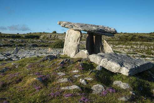 Poulnabrone dolmen on land against clear blue sky during sunny day, Clare, Ireland - BIGF00078