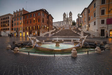 Italy, Rome, Spanish Steps, Piazza di Spagna, Barcaccia Fountain, Fountain on town square at dawn - ABOF00650