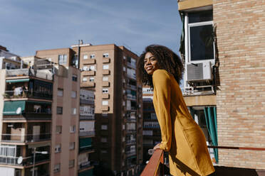 Tall Female Woman Standing By Condo Stock Photo - Alamy