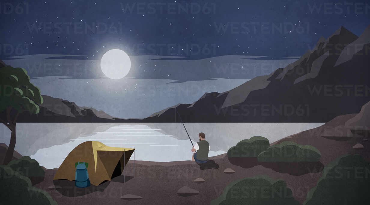 Moonlight over man fishing at remote lakeside campsite stock photo