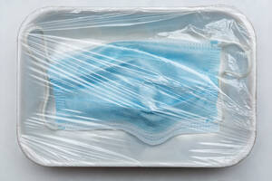 Face mask under plastic wrap on tray - FSIF05605