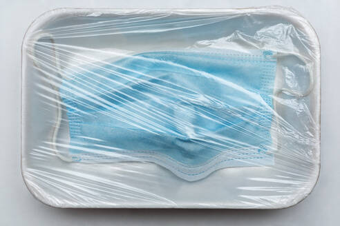 Face mask under plastic wrap on tray - FSIF05605