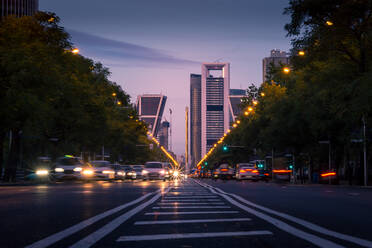 Magnificent view of asphalt road with traffic cars at dusk in Madrid - ADSF20336