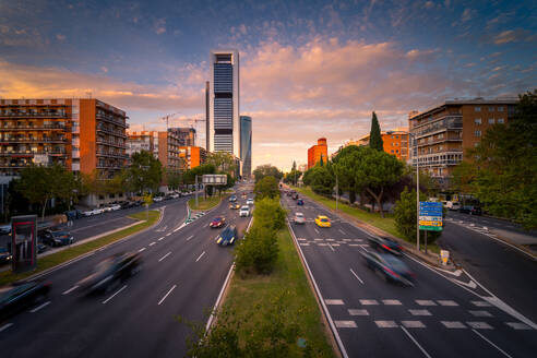 Magnificent view of asphalt road with traffic cars at evening in Madrid - ADSF20337