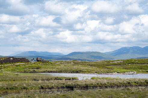 Idyllic view of river amidst field against sky - BIGF00091