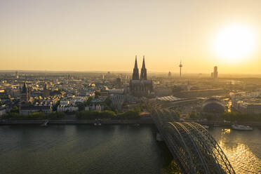 Germany, Cologne, Rhine River, View of river and city at sunset - TAMF02801