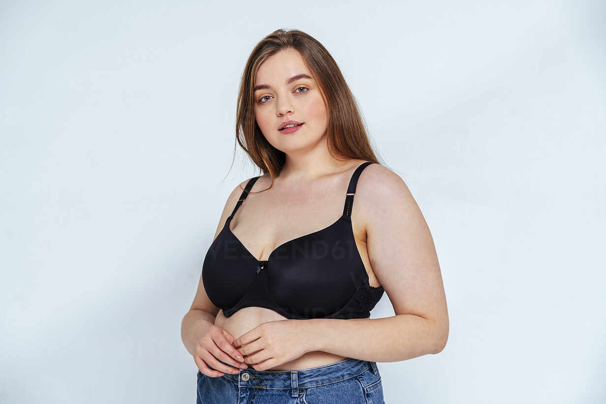 https://us.images.westend61.de/0001510677pw/curvy-fashion-model-wearing-bra-and-jeans-standing-against-white-background-OIPF00093.jpg