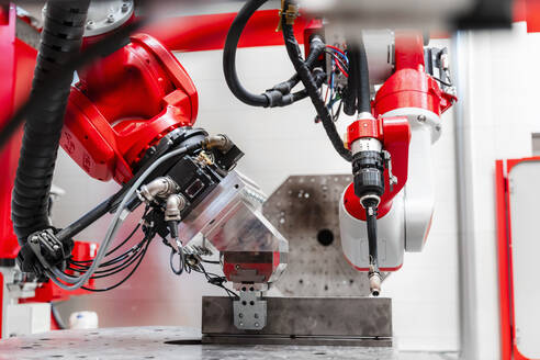 Close-up of robotic welding machinery in factory - DIGF14346