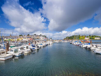 Boats moored at harbor against cloudy sky - LAF02649