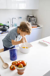 Little boy cooking in kitchen at home - IFRF00353