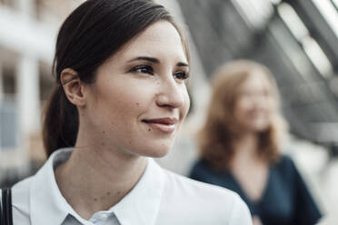 Thoughtful female entrepreneur looking away in office - JOSEF03322