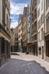 Narrow alley with row house in old town of Chur, Switzerland - TAMF02822