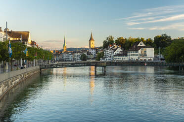 Limmat river waterfront with St. Peter's and Fraumunster Church in Zurich, Switzerland - TAMF02827