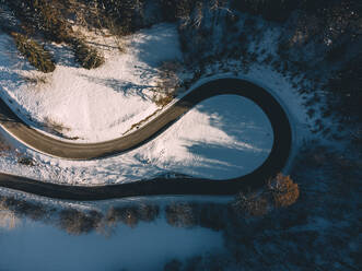 Aerial view of hairpin curve of empty alpine road, Germany - ELF02339