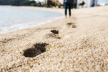 Footprints on sand at beach - JRFF05019