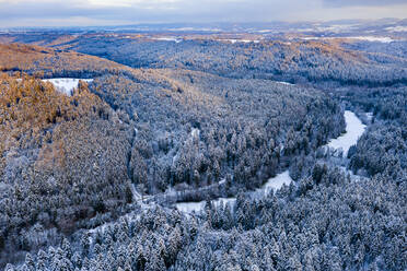 Drone view of forested Remstal valley at winter dusk - STSF02794
