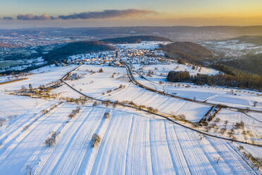 Drone view of snow-covered fields at winter dusk - STSF02797