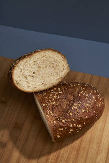 Half loaf of bread on cutting board - BOYF01761