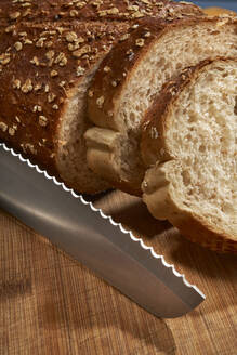 Slices of bread and knife indoors - BOYF01762