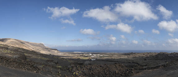 Landscape view of Orzola against sky, Lanzarote, Spain - SNF01128