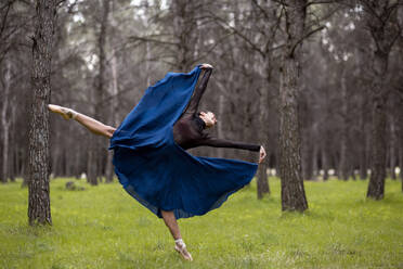 Young professional dancer dancing in forest - JCCMF01031