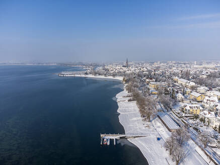 Germany, Baden-Wurttemberg, Radolfzell, Aerial view of snow-covered town on shore of Lake Constance - ELF02343