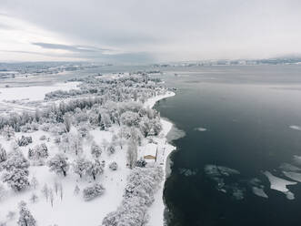 Germany, Baden-Wurttemberg, Radolfzell, Aerial view of snow-covered Mettnau peninsula - ELF02344