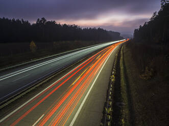 Light trails on motorway against sky during dusk - HUSF00222