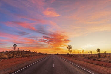 Lasseter Highway at moody sunrise, Australia - FOF12034