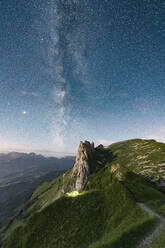 Milky Way in the starry sky over Saxer Lucke mountain, aerial view, Appenzell Canton, Alpstein Range, Switzerland, Europe - RHPLF19072