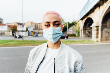 Young woman wearing face mask - ISF24365