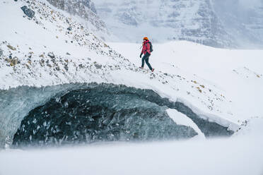 Mountaineer Explores Alberta's Frozen Ice Caves - CAVF92194