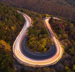 Aerial view to the road with car traffic at night in the mountain - CAVF92275