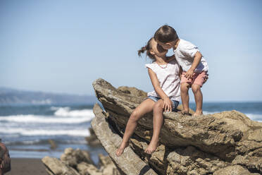 children enjoying the beach and cliffs of the Basque country - SNF01143