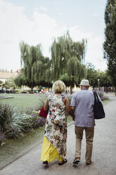 Senior couple spending leisure time in park during vacation - MASF21893