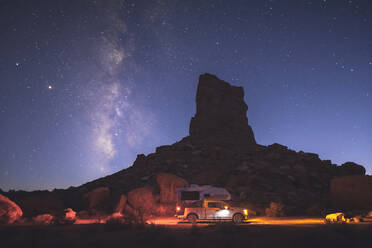 A small pickup RV is on a camping spot under the Milky Way - CAVF92352