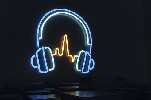 Illuminated blue headphones in darkroom - NMCF00021